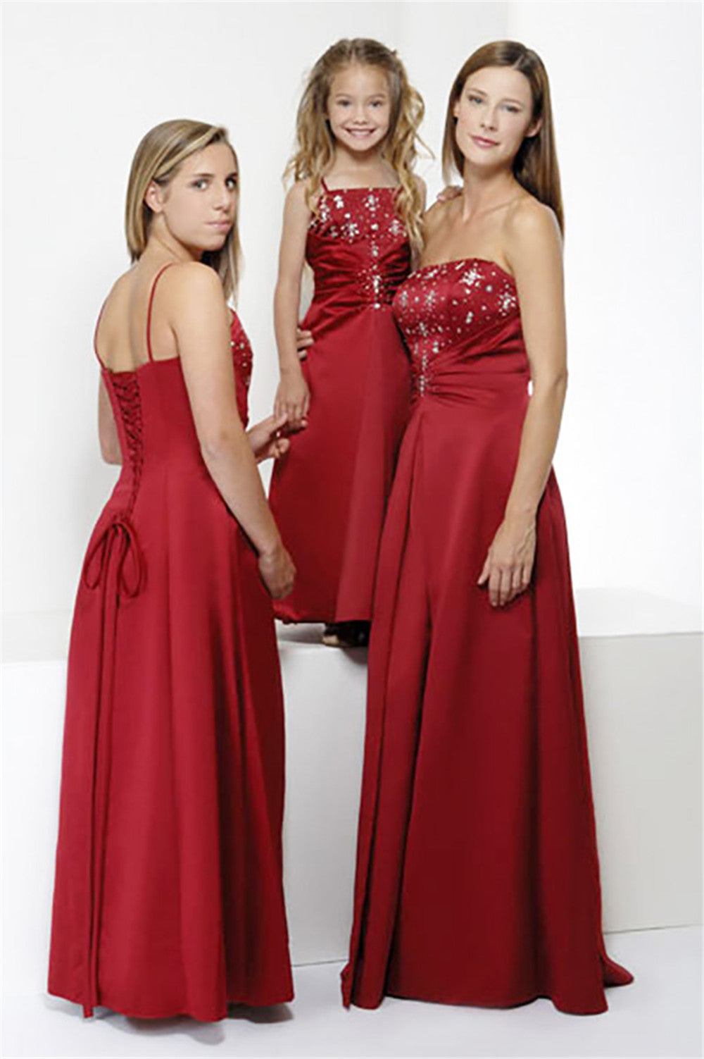 Red full-length bridesmaid dress style 0154 with built-in bra and lace-up back, shown on adult, teen, and child models for weddings.